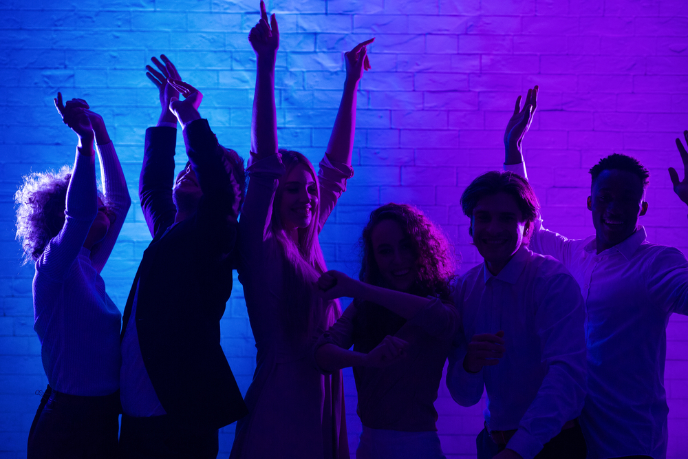 Joyful Millennial People Dancing Having Party In Office At Night